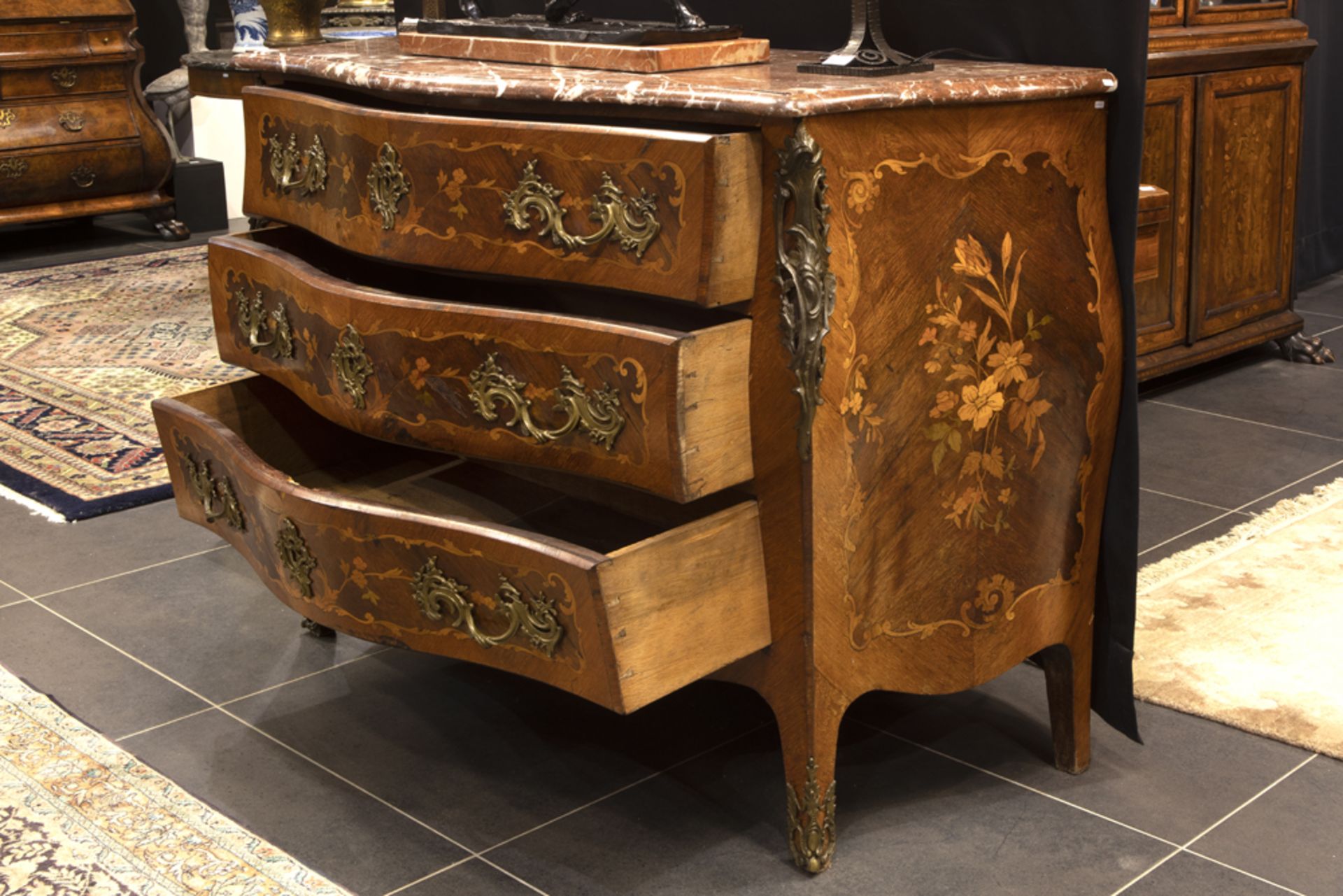 antique French Louis XV style chest of drawers in marquetry with mountings in gilded bronze and with - Image 2 of 2