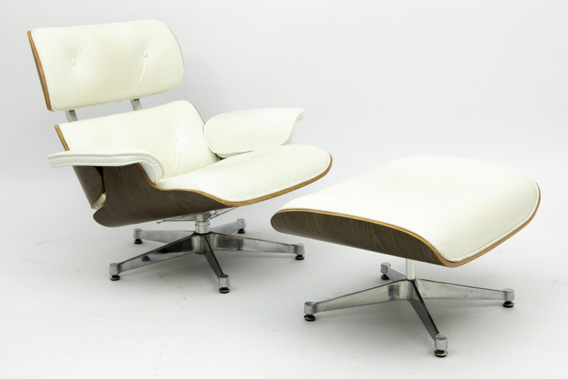 set of lounge chair and ottoman after the famous design by Charles & Ray Eames in white leather,