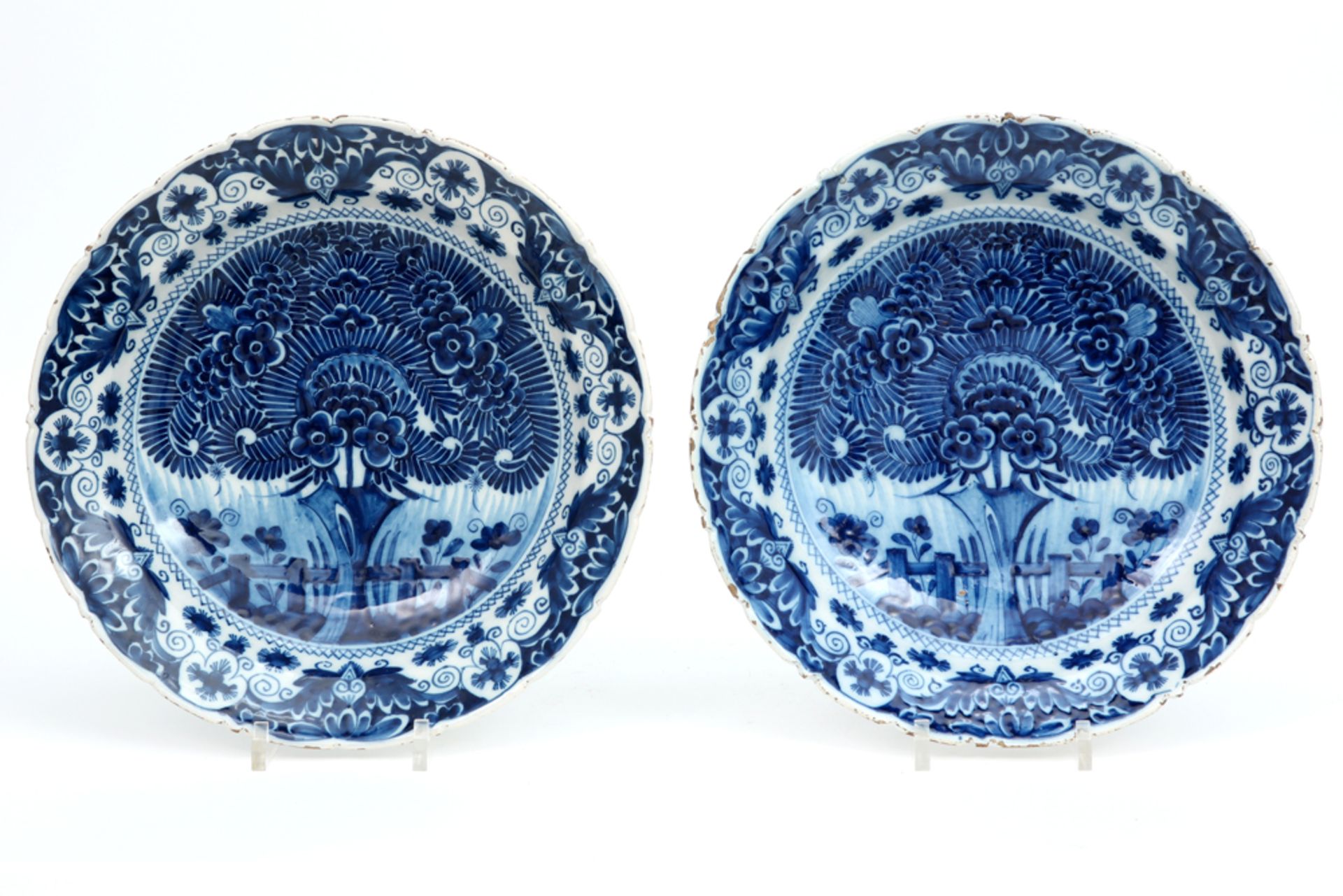 pair of quite big 18th Cent. dishes in marked ceramic from Delft with a blue-white decor || Paar