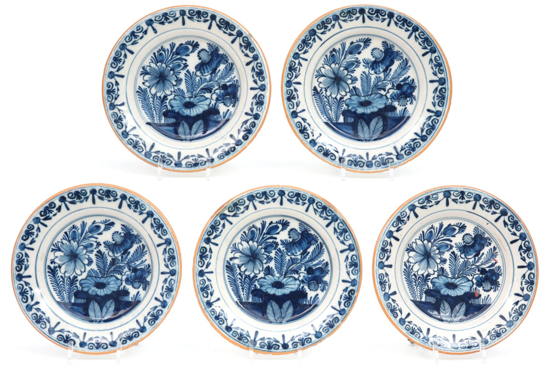 set of five 18th Cent. plates in ceramic from Delft with a blue-white garden decor || Serie van vijf