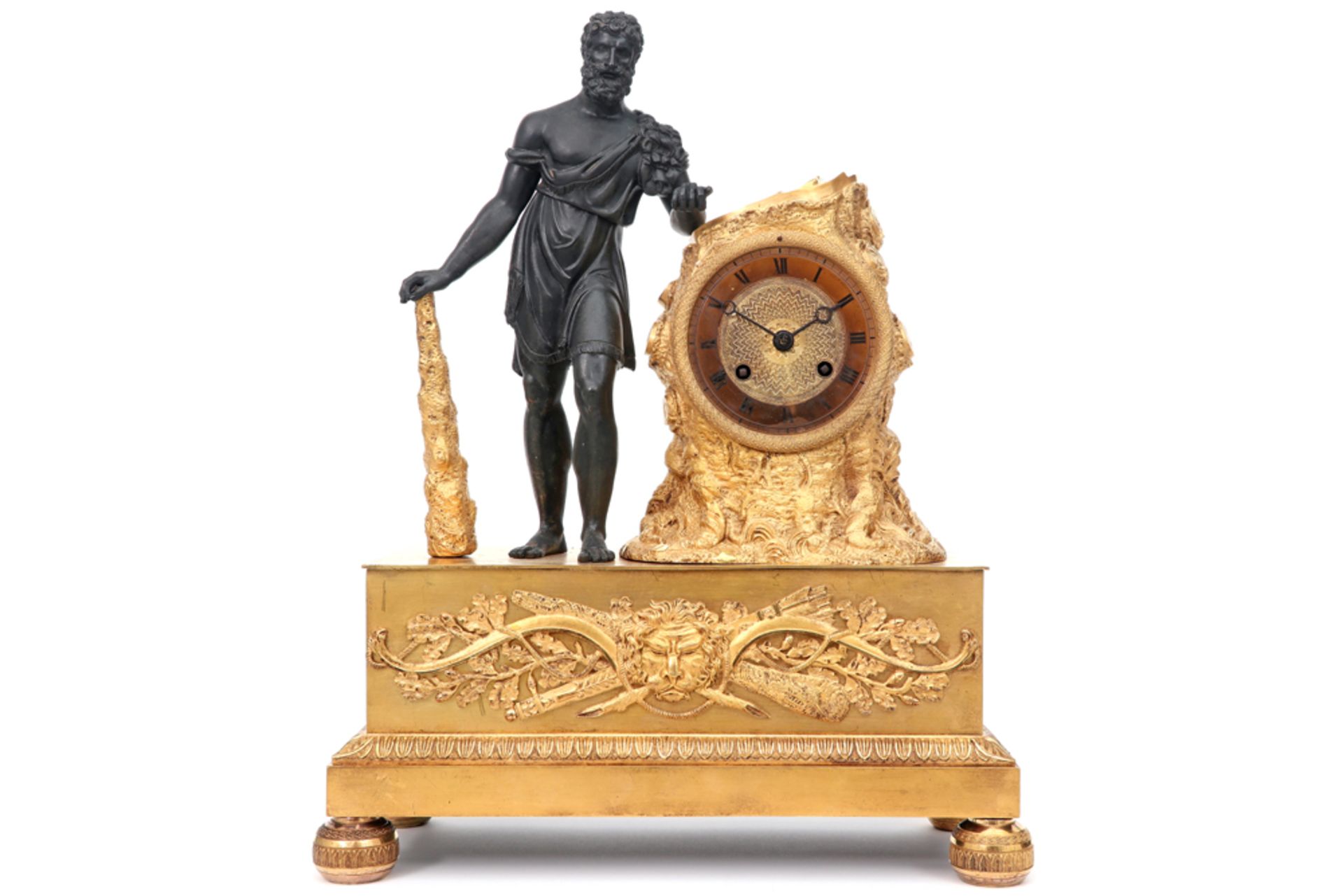 early 19th Cent. French Empire style clock in partially gilded bronze with a sculpture of