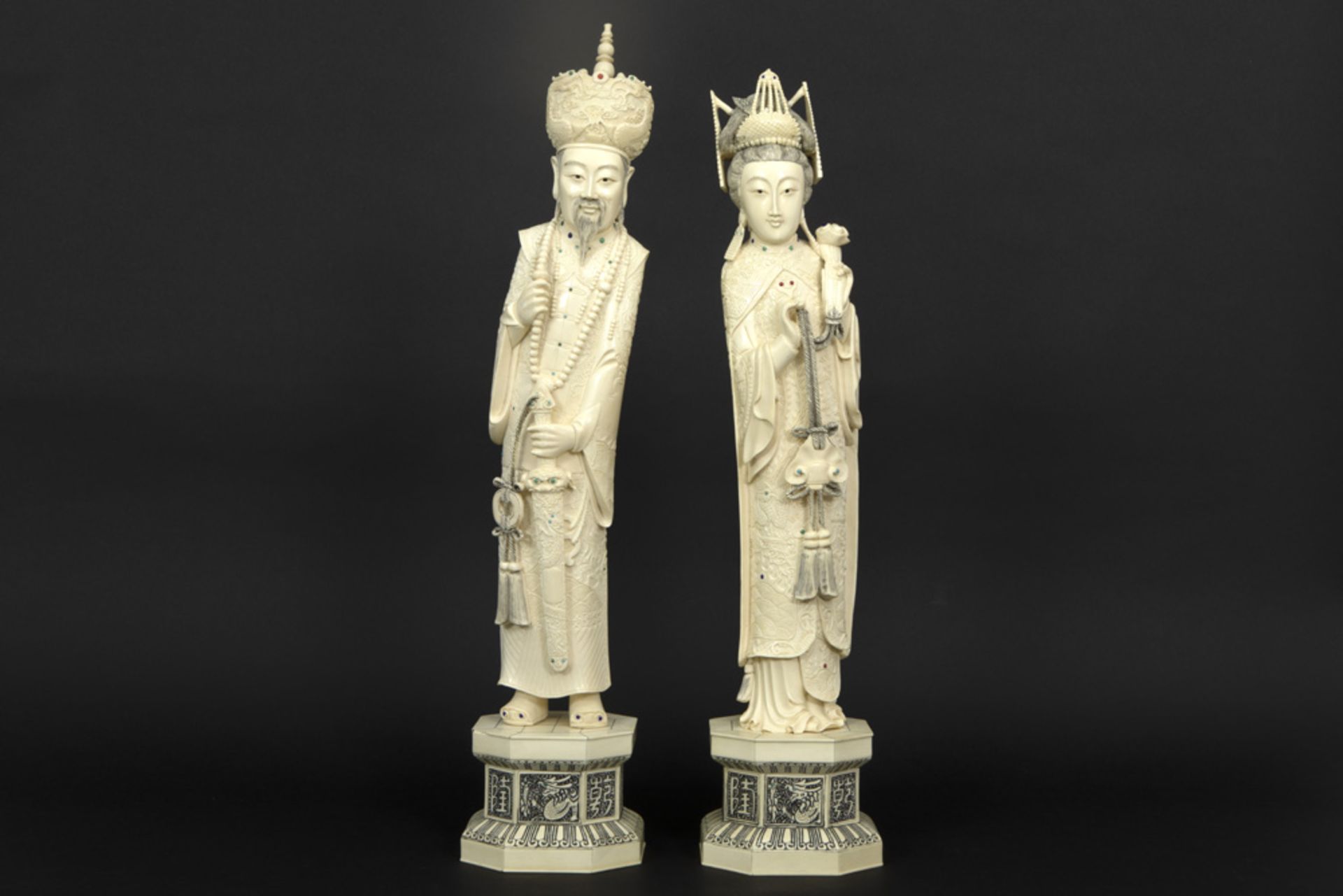 pair of old Chinese "King and Queen" sculptures in ivory with inlaid beads in coral and lapis lazuli