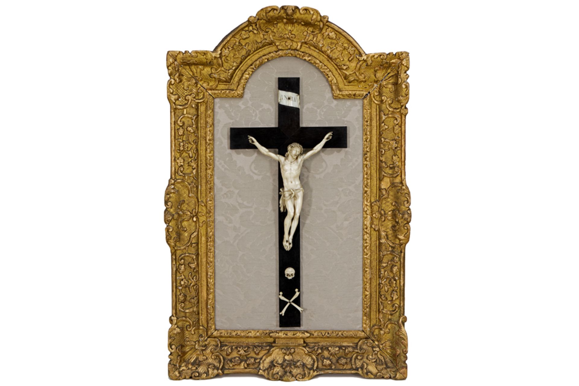 probably 18th Cent. ivory Christ corpus on an ebonised wooden cross - with gilded frame || Allicht