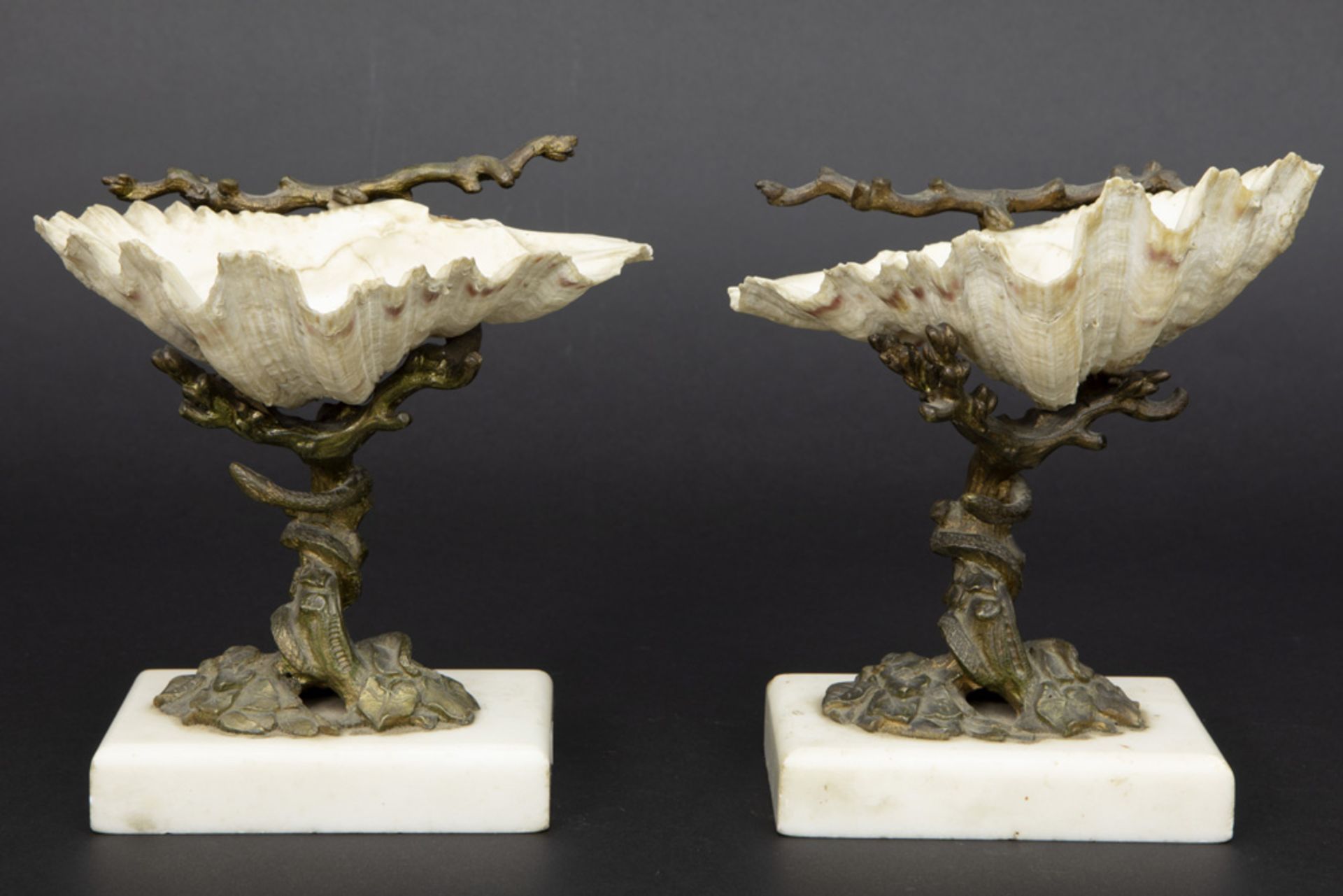 pair of antique table-ornaments (salts) each with a shell mounted in gilded bronze on a marble