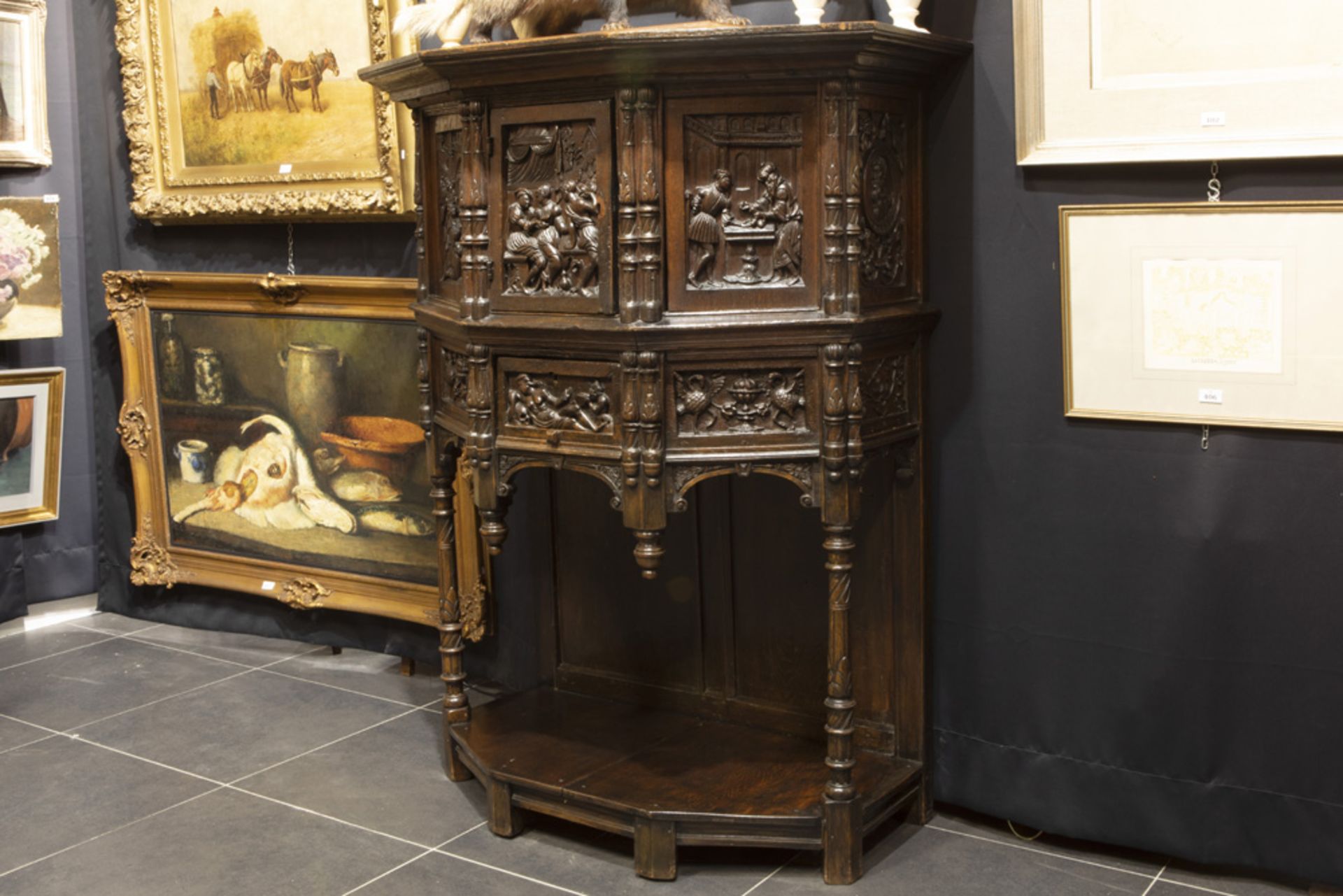 antique oak cabinet with presumably older panels with finely sculpted Renaissance style