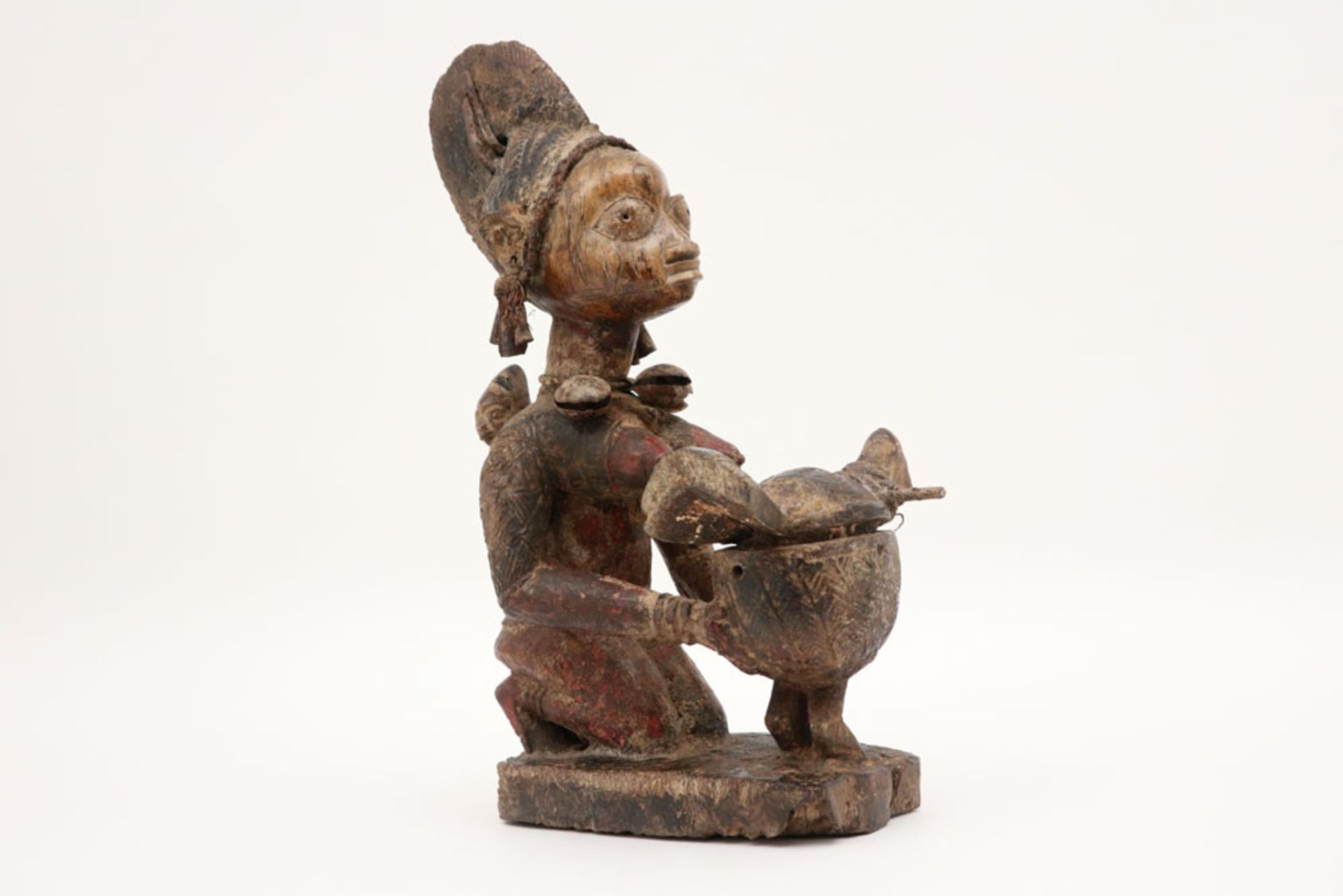 Nigerian Yorouba "Ekiti Efon-Alaye"-sculpture in wood, textile, raffia, metal with remains of