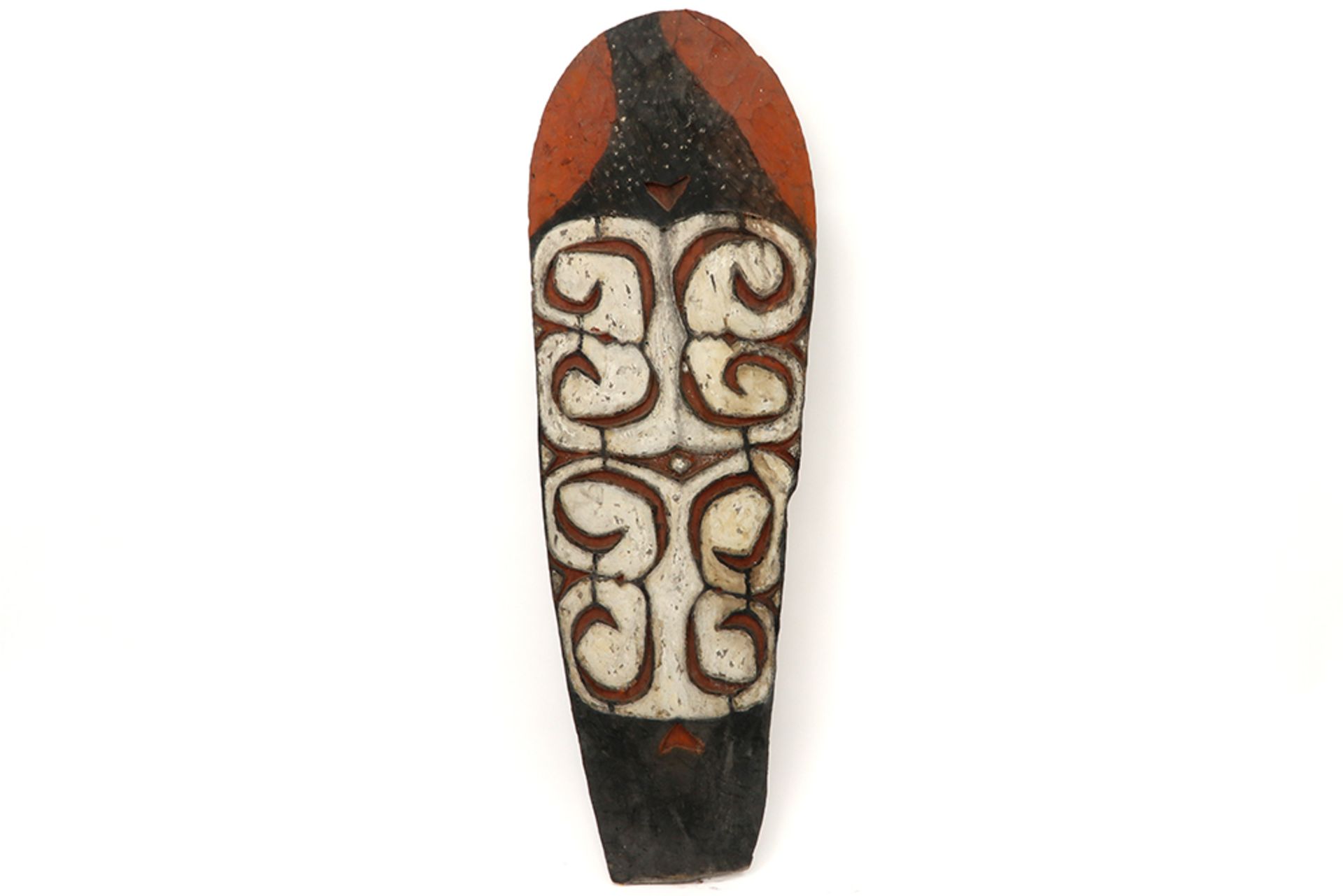 Papua New Guinean Asmat shield in wood with pigment polychromy, typical carvings and a figure on the
