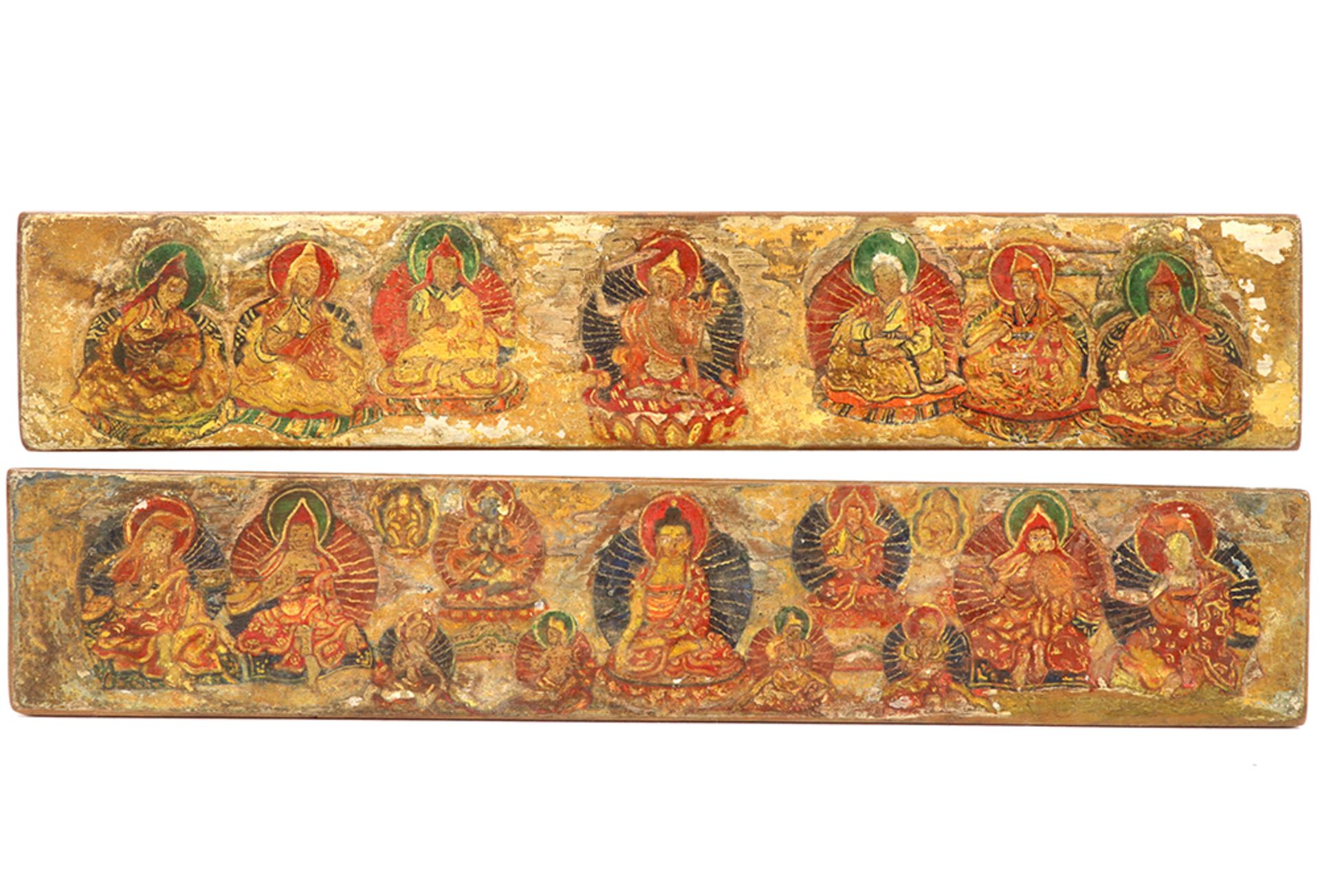 two antique Tibetan bookcovers in painted wood with the representation of "Buddha" in the center and