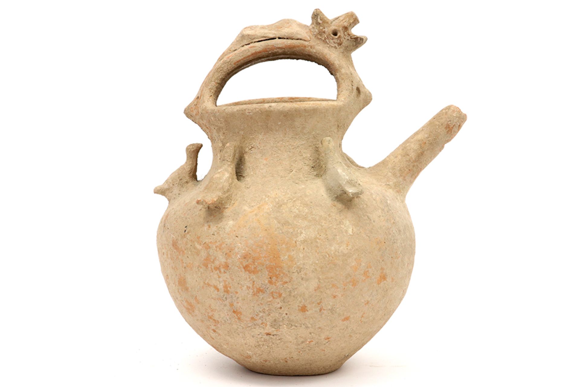 rare Ancient Persian ritual spout pot in earthenware adorned with five pigeons and with a mythical