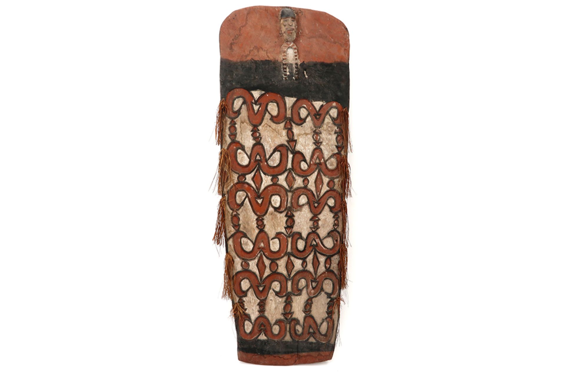 Papua New Guinean Asmat shield in wood with pigment polychromy, typical carvings and a figure on the