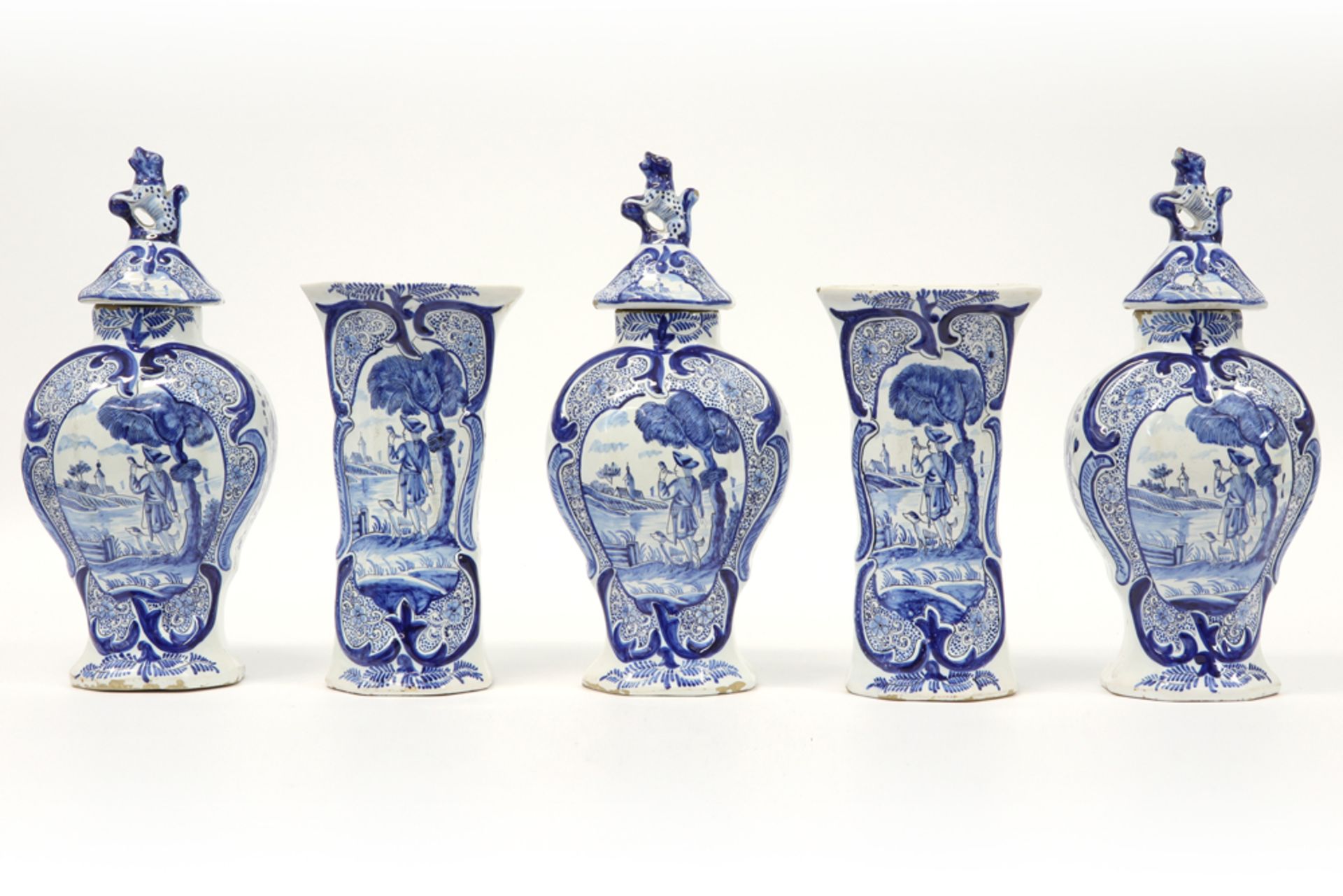 18th Cent. 5pc garniture in marked ceramic from Delft with a blue-white decor || Achttiende eeuws