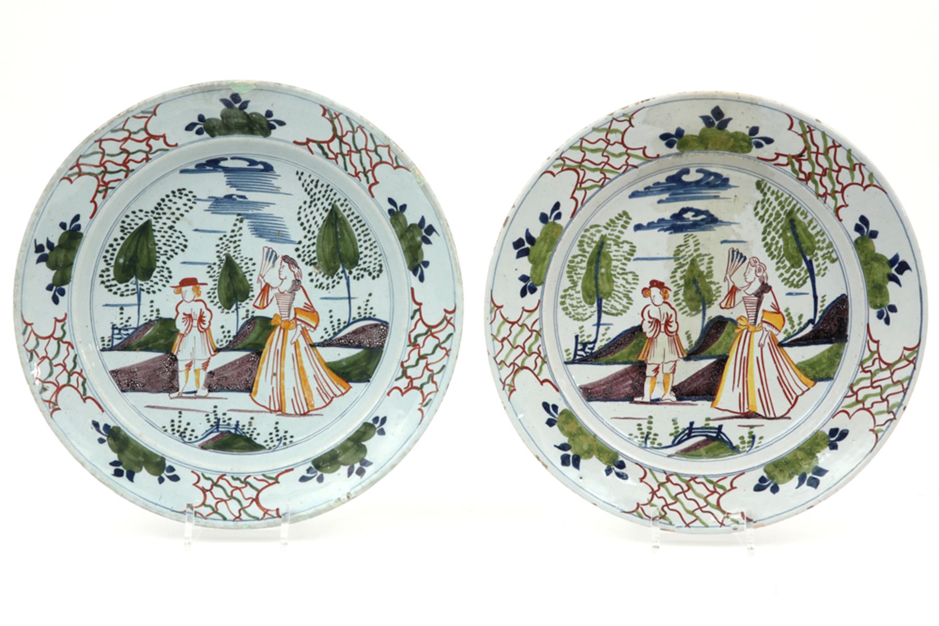 pair of 18th Cent. dishes in ceramic from Delft with a polychrome decor with a lady with fan and
