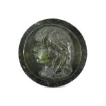 round bronze medaillon with the profile of Coco - on a round marble base - signed Renoir || RENOIR