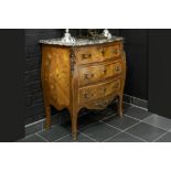early 20th Cent. Louis XV style chest of drawers in marquetry with bronze mountings and a marble top