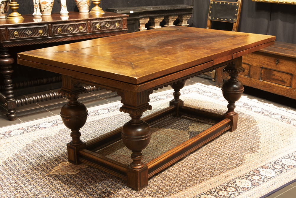 set of a Renaissance revival table in oak and ebony and a set of 10 oak chairs in Flemish