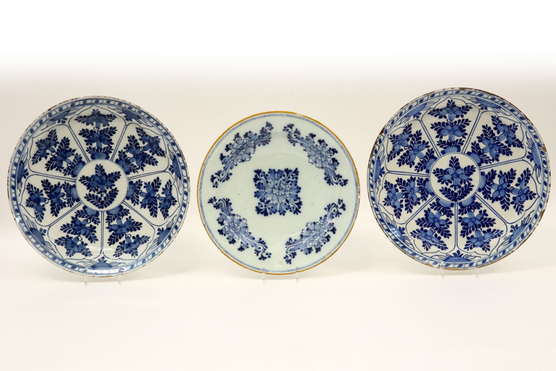 three 18th Cent. dishes in ceramic from Delft with a blue-white decor : a pair and a marked one ||