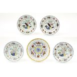 five pieces of 18th Cent. ceramic from Delft with polychrome decor : four plates and a dish ||