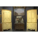pair of curved corner cabinets, partly made of antique furniture, in painted wood and each with