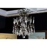 chandelier in bronze and clear crystalglass || Mooie luster met een montuur in brons rijk versierd