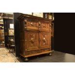 17th/18th Cent. Renaissance style cupbaoard in oak and walnut with typical sculpted ornamentation ||