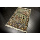 handknotted Lahore rug with a typical Persian design with figures in a landscape || Handgeknoopt