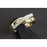 ring in yellow and white gold (18 carat) with ca 0,10 carat of high quality brilliant cut