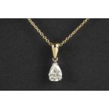 a 1,26 carat high quality oval brilliant cut diamond set in a pendant in white and yellow gold (18