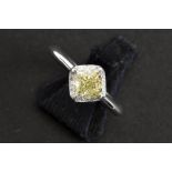 a 1,38 carat fancy yellow high quality princess' cut diamond set in a ring in platinum with ca 0,