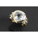 heartshaped aquamarien blue topaz of ca 5 carat set in a ring in yellow gold (18 carat) with