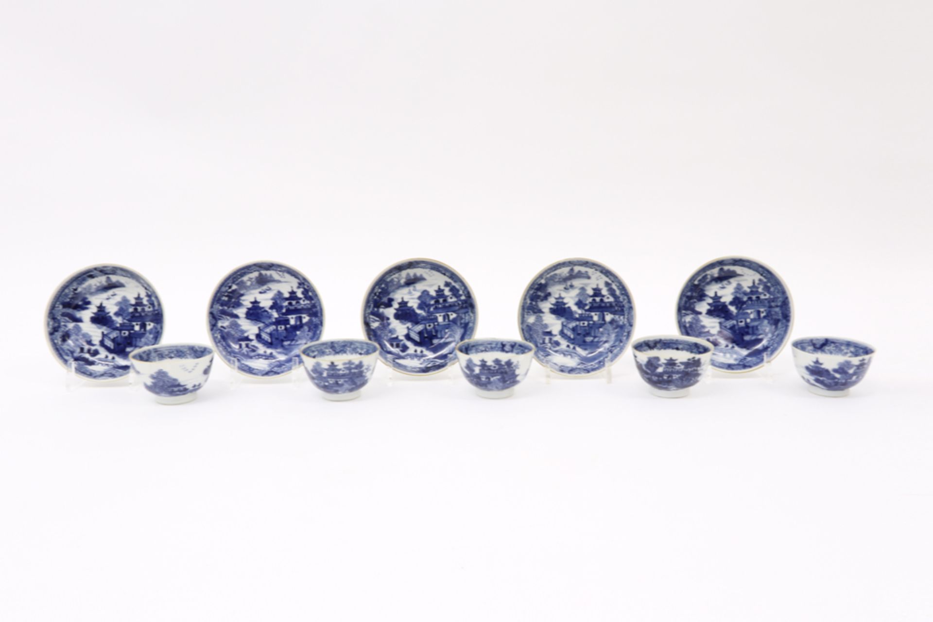 series of five 18th Cent. Chinese porcelain sets of cup and saucer with blue-white landscape