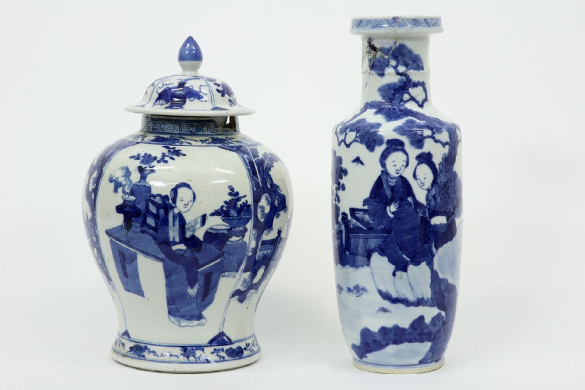 two antique Chinese damaged items in marked porcelain with a blue-white decor : a vase with cover