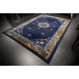 antique Chinese rug with a quite traditional design with medaillon on a blue background || Antiek