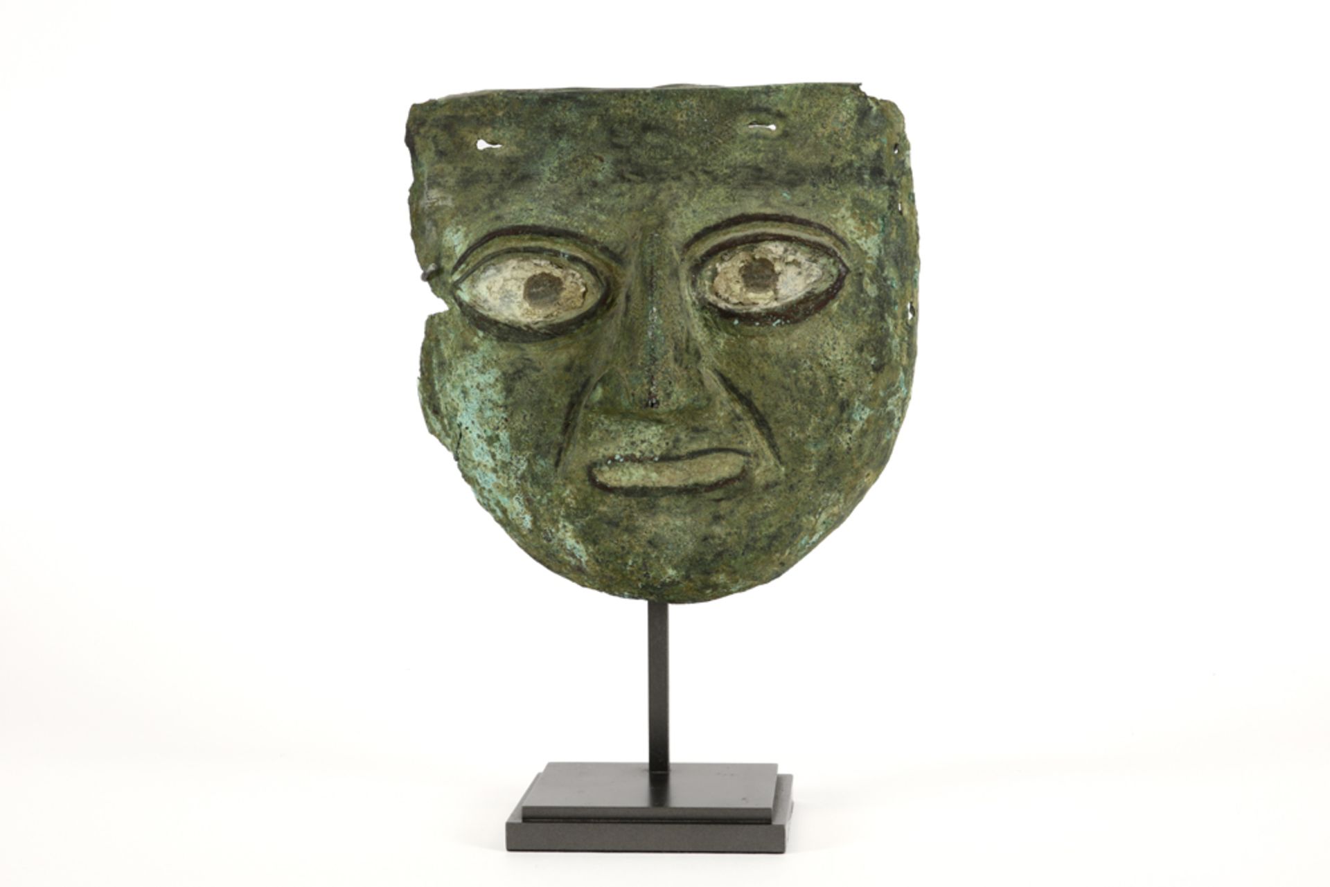 approx. 2000 year old Pre Columbian mask in a copper alloy with inlaid eyes prov : former collection