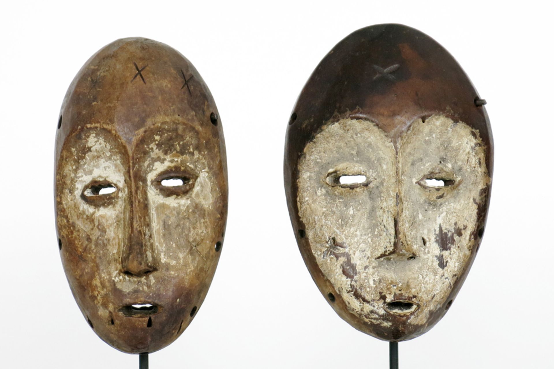 two African Congolese 'Lega' masks in wood with typical shape and features || AFRIKA - KONGO - 1°