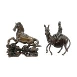 two antique oriental bronze" horses", one with a nicely carved wooden base || Twee antieke