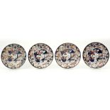 series of four 17th/18th Cent. Japanese Arita dishes in porcelain with a garden decor || Reeks van