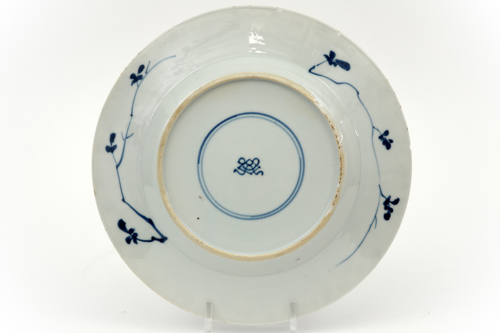 18th Cent. Kang Hsi period dish in marked porcelain with a blue-white decor with a fish scales motif - Image 2 of 2