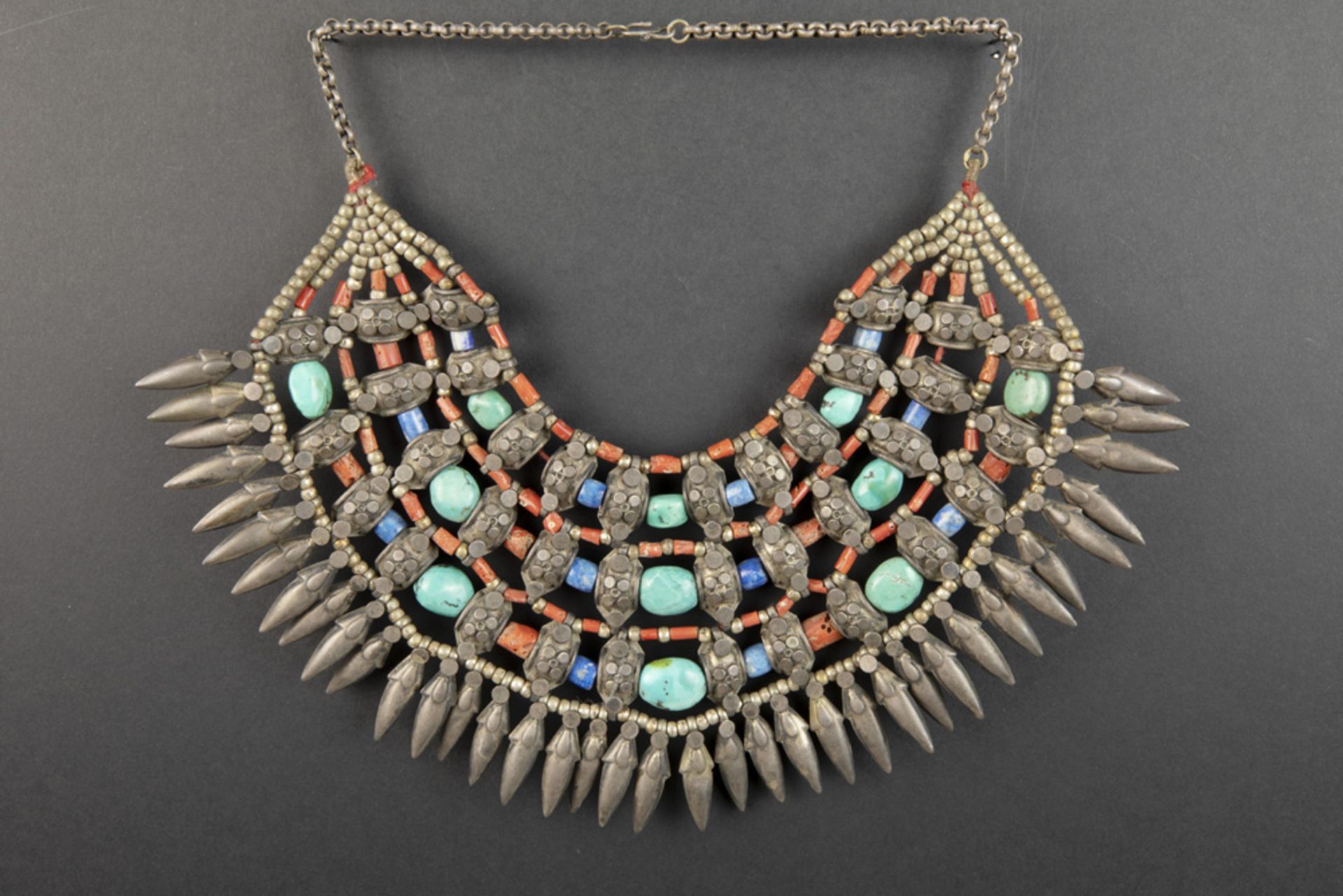 ethnic necklace with bigger beads of turquoise and lapis lazuli, smaller ones in coral and with