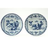 pair of 18th Cent. Chinese plates in porcelain with a blue-white decor with a scroll with garden