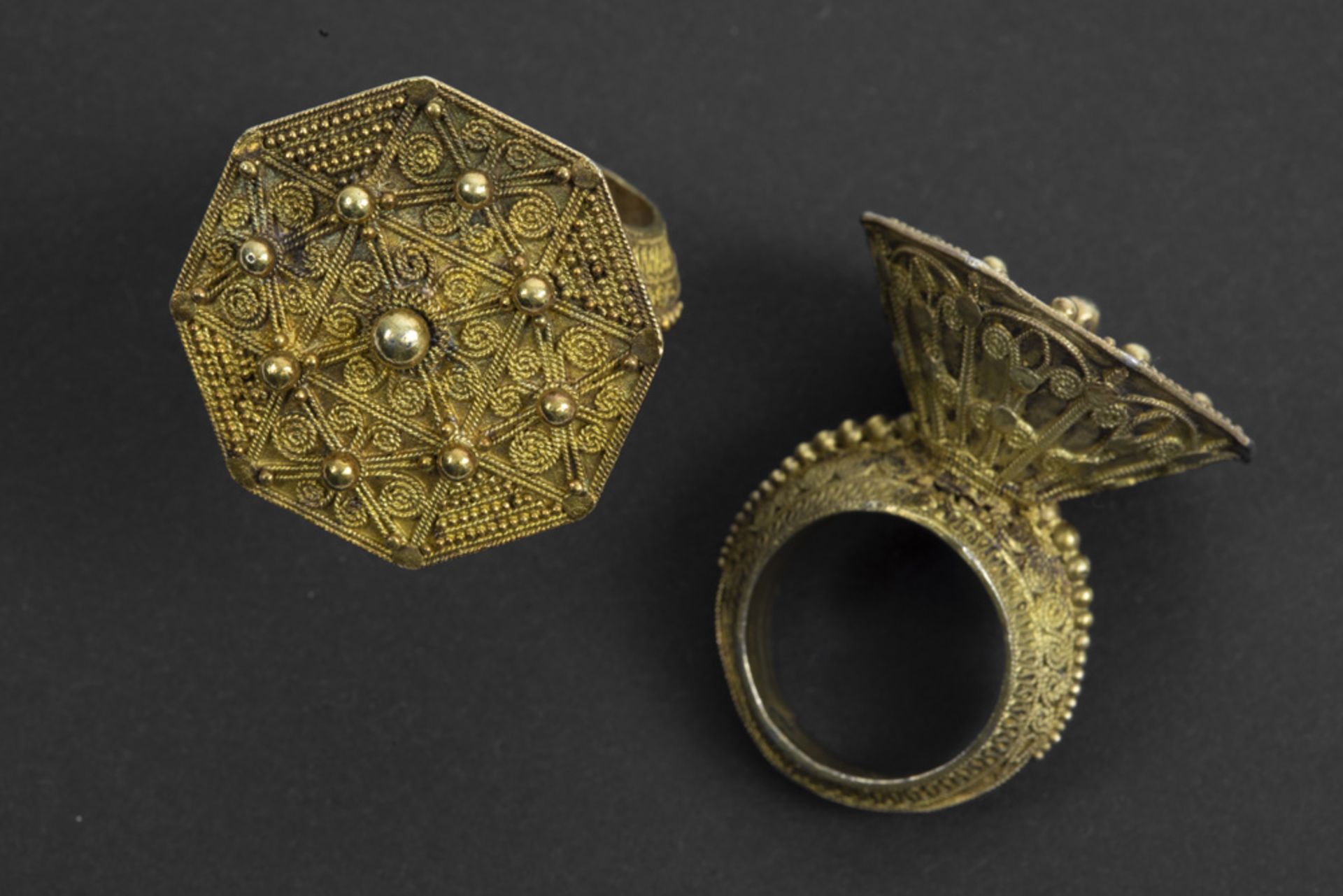two 'antique' Indonesian Sumatra rings from the Batak with typical design in gilded silver - part of