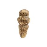 neolithical stone fertility idol with a typical stylised female shape || Neolitisch