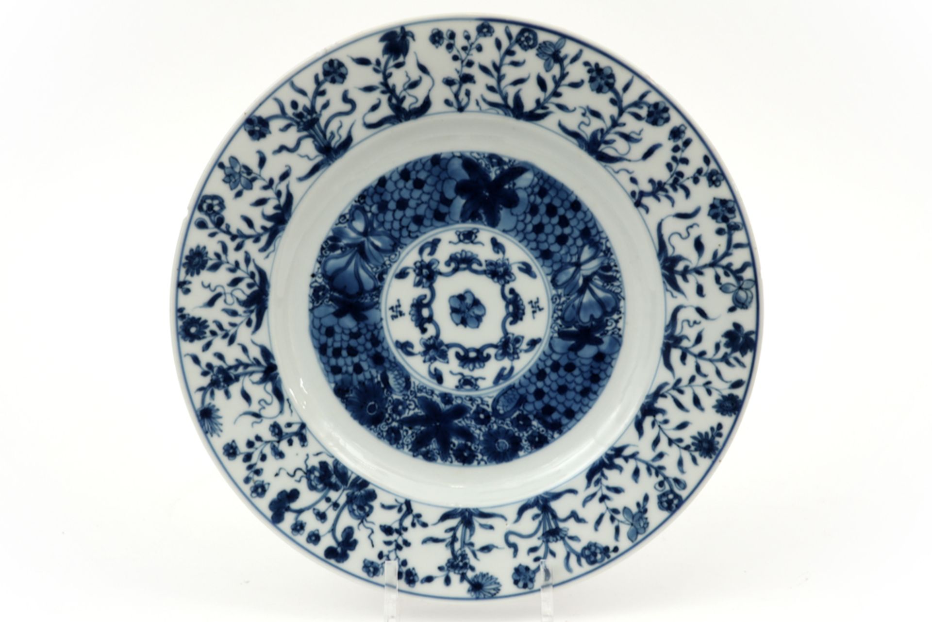 18th Cent. Kang Hsi period dish in marked porcelain with a blue-white decor with a fish scales motif