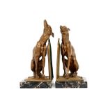 pair of most probably French Art Deco book-ends in marble and bronze each with a Greyhound sculpture