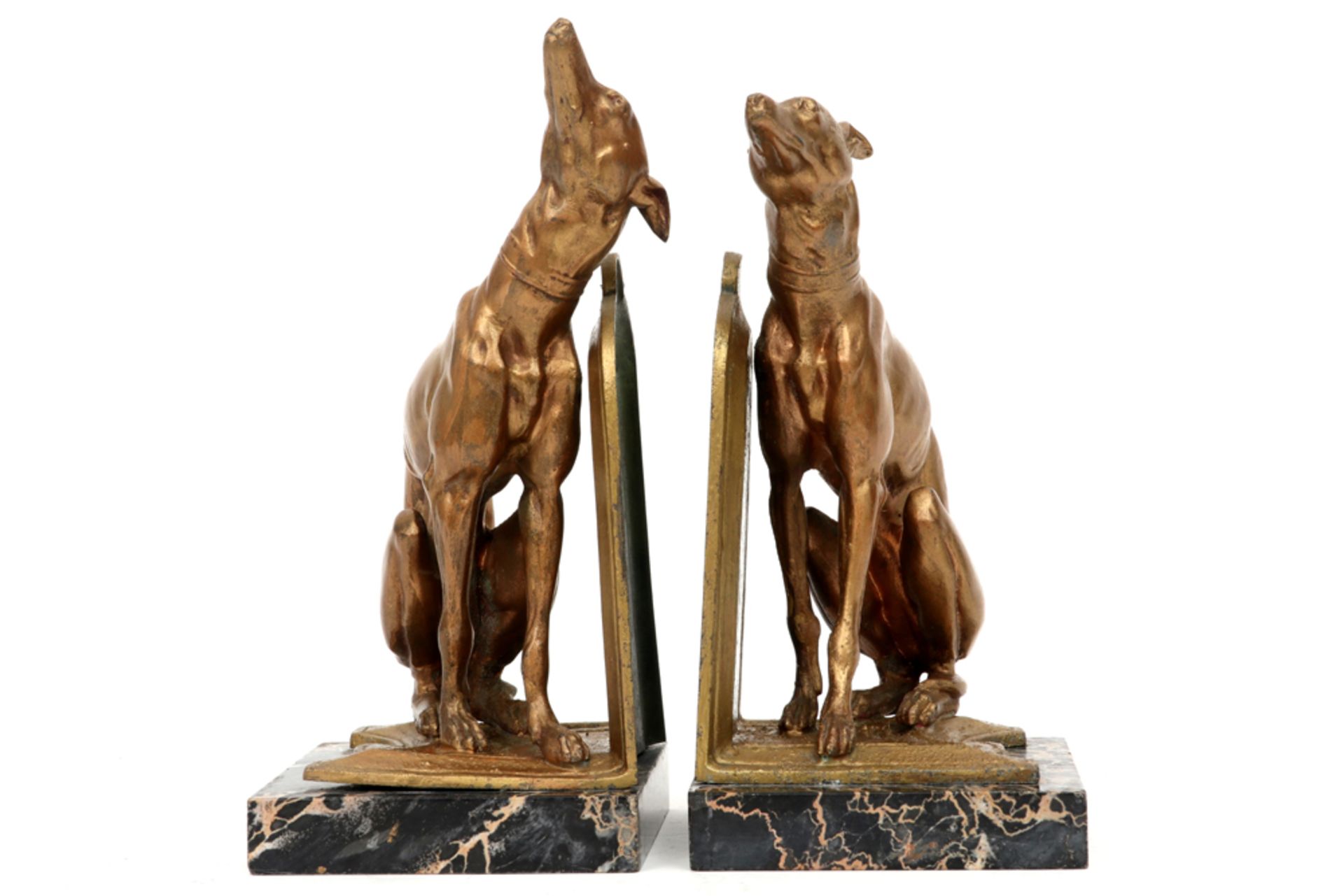 pair of most probably French Art Deco book-ends in marble and bronze each with a Greyhound sculpture