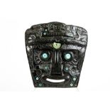 antique Bolivian carved stone masque with slices of turquoise with a report of "Conservation and