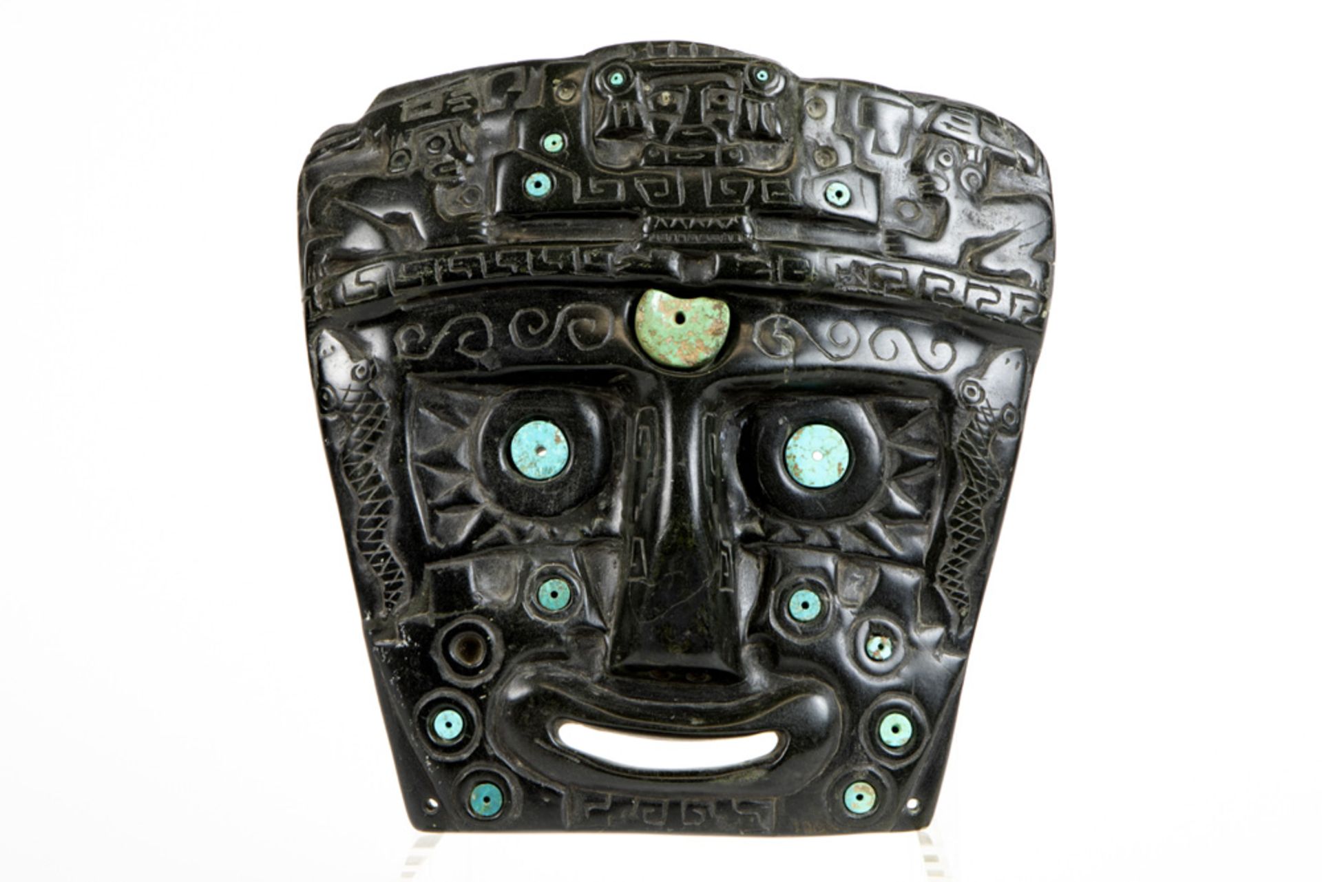 antique Bolivian carved stone masque with slices of turquoise with a report of "Conservation and