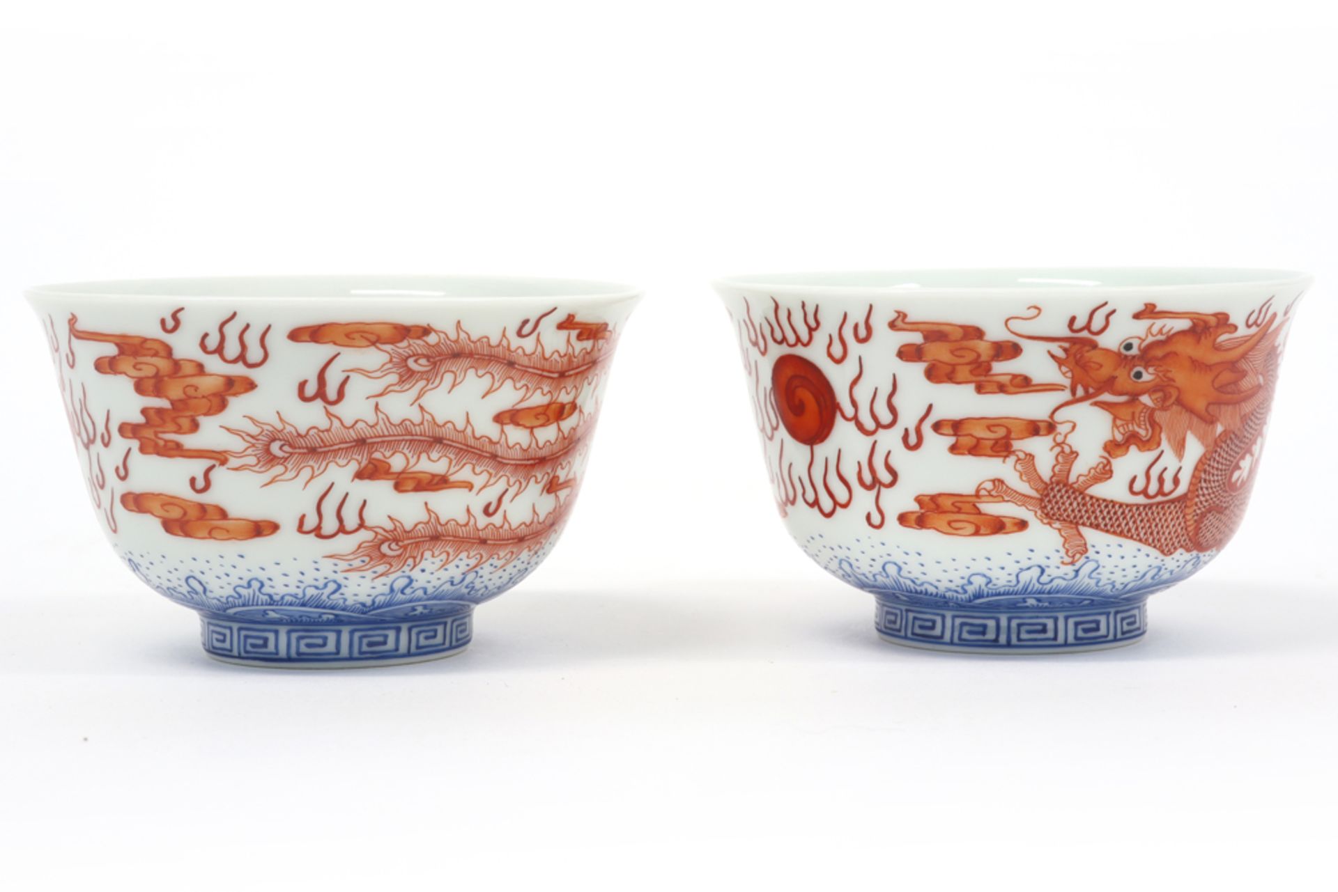pair of Chinese cups in marked porcelain with blue-white and sanguine decors, one with a dragon - Image 3 of 6