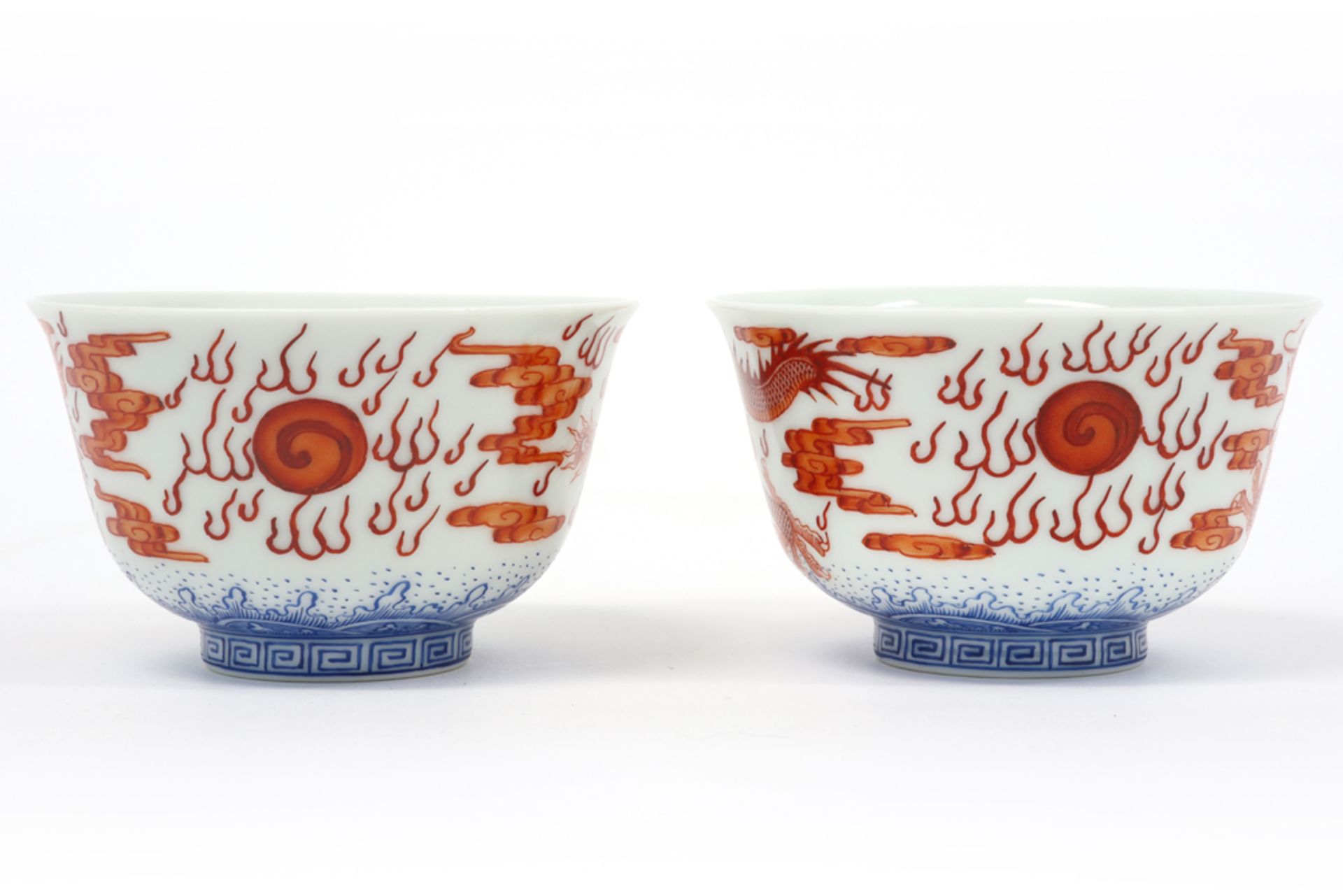 pair of Chinese cups in marked porcelain with blue-white and sanguine decors, one with a dragon - Image 2 of 6