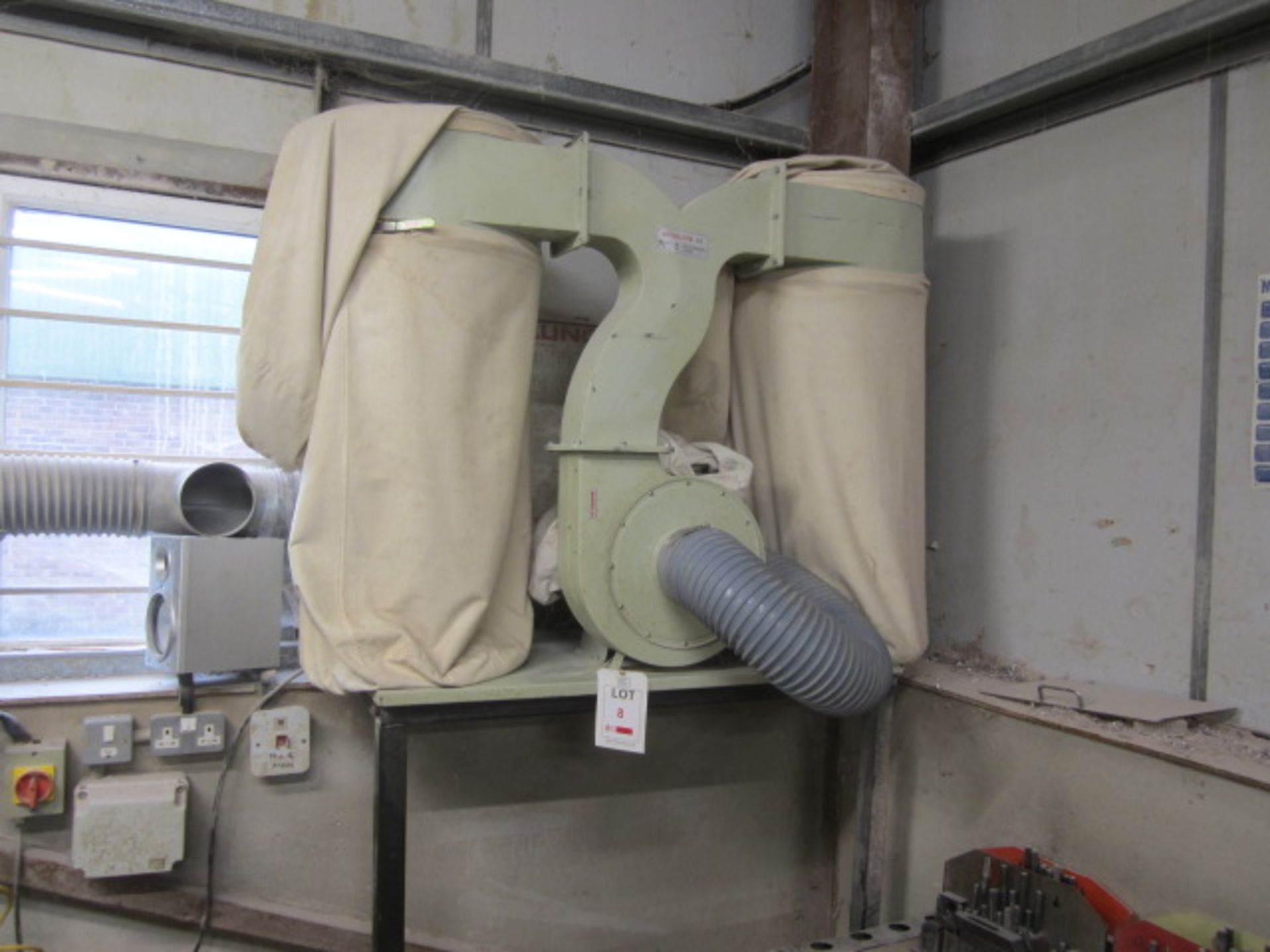 Twin bag dust extraction unit mounted on part metal stand. Located at Supreme Engineering,