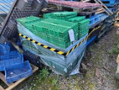 Fourteen assorted plastic pallets and one pallet of green plastic collapsible carry crates